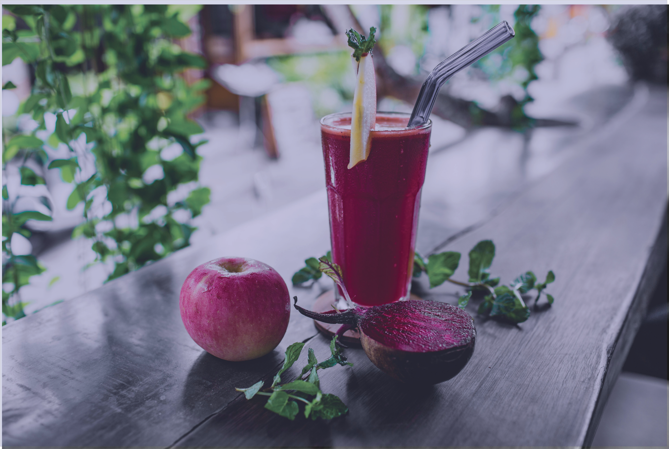 fruit smoothie resting on a table